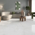 a living room with huge tile that that loos like a white marble with beige veining
