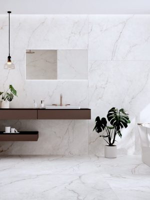 a bathroom scene with 63x63 tile white marble floor and wall in warm tones