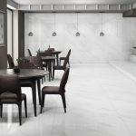 A living room with 48x48 floor tiles in whit color and subtle gray veining