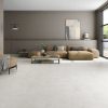 Concrete look tile in the large format 63x63 size in a modern living room that looks seamless