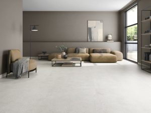 Concrete look tile in the large format 63x63 size in a modern living room that looks seamless