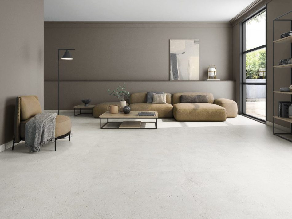 Concrete look tile in the large format 63x63 size in a modern living room that looks seamless