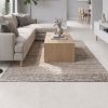24x48 Soft Cement White concrete look tile in a cosy living room, making the room feel better with its subtle design and minimal grout lines