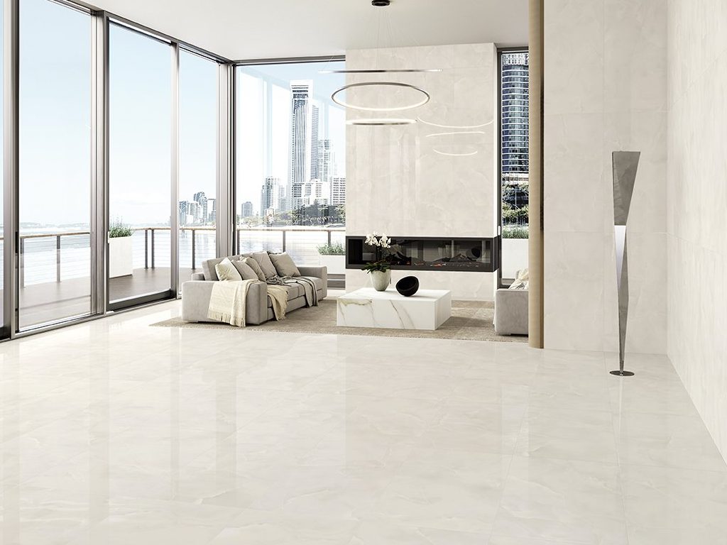 Marble look large format porcelain tile that makes the living room more spacious by eliminating the seam and adding a clean, natural feel to the interior.