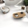 A modern living room with a 48×48 matte marble look porcelain tile