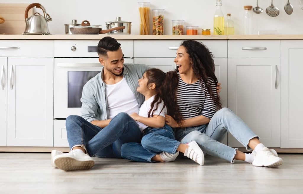 Miami Tile Store 4 picture showing a happy family sitting on their new kitchen floor tile