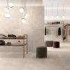 Stone look tile 24x48 tune ivory on as wall tile in a high-end boutique
