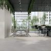 large format 48x48 porcelain tile floors and walls in a modern office space in a creamy white color