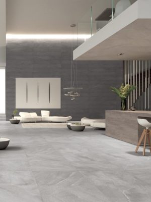 a luxurious hotel lobby with limestone effect tile Burlington Rock on the floor and Burlington Perla around the reception