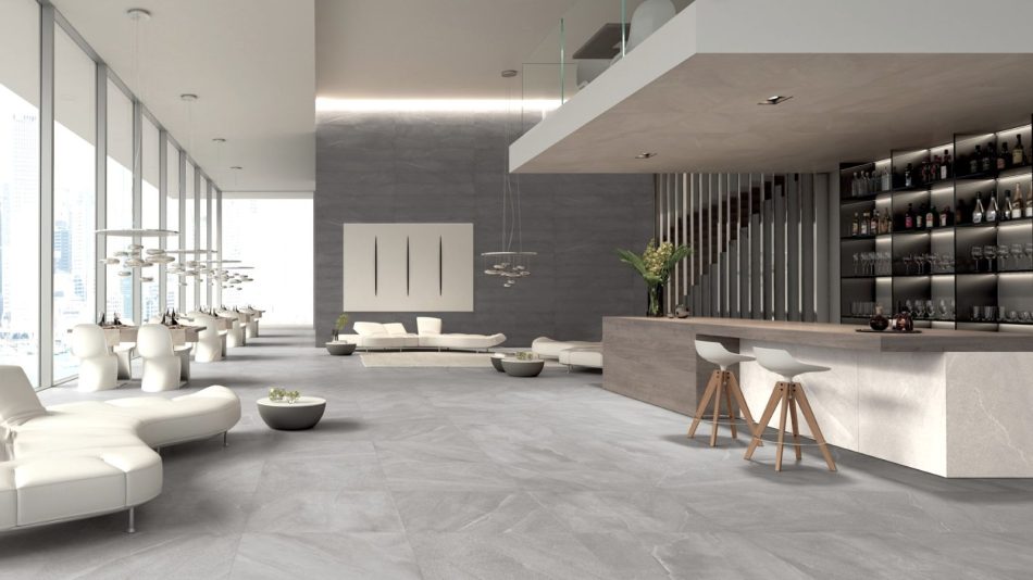 a luxurious hotel lobby with limestone effect tile Burlington Rock on the floor and Burlington Perla around the reception