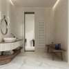 a luxurious, modern bathroom designed with Calacatta Gold porcelain tile