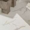 pictures showing graphic details of Statuario White Italian tile in bathroom