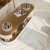 48×48 Calacatta Gold polished porcelain tile is an ideal choice for those seeking to infuse their interiors with the warmth and luxury