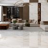 picture showing a stunning living room that is both luxurious and modern with Calacatta Gold Marble look porcelain tile in extra large format