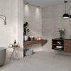 a modern bathroom design with 24x48 Sandstone Pearl, 24x48 Sandstone Gray, walls, and 48x48 Sandstone Gray floors.