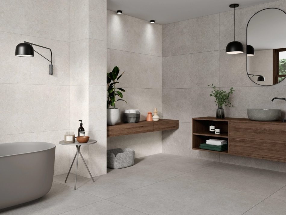 a modern bathroom design with 24x48 Sandstone Pearl, 24x48 Sandstone Gray, walls, and 48x48 Sandstone Gray floors.