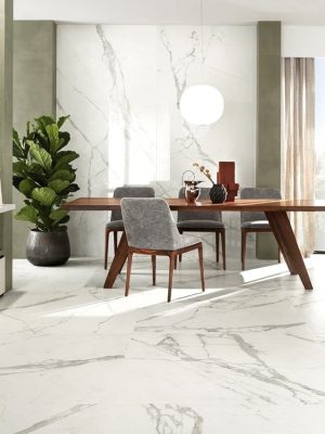 a luxurious dining room area with white Italian marble tile on the floor