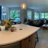 24X48 polished concrete look tile Natron Grey in an open kitchen floor