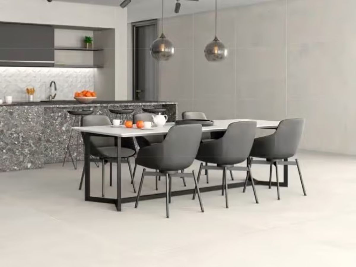 open kitchen with concrete look tile flooring