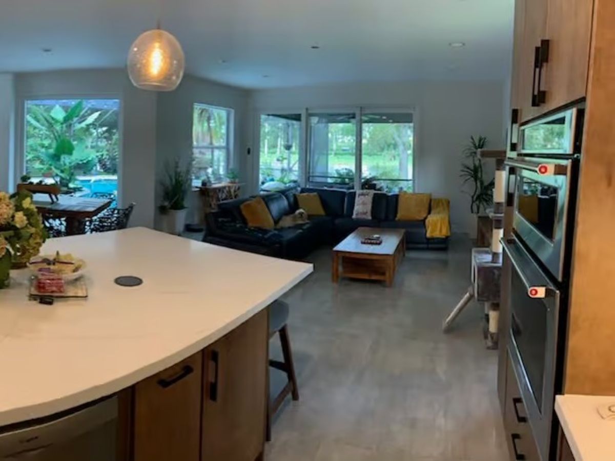 Concrete Look Tiles & Beyond: Subtle Flooring Options 8 Natron Grey Polished Tile in an Open Kitchen