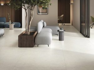 Large format 48x48 porcelain tile floor with minimal grout lines in a modern interior