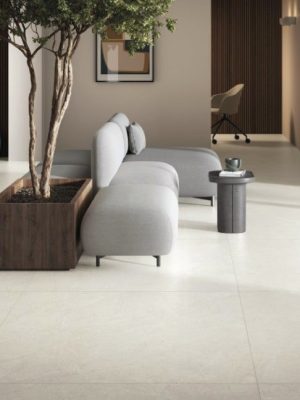 Large format 48x48 porcelain tile floor with minimal grout lines in a modern interior