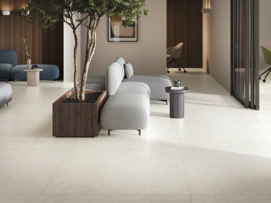 Large format 48x48 porcelain tile floor with minimal grout lines in a modern interior