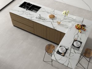 Concrete Look Tiles & Beyond: Subtle Flooring Options 1 Modern kitchen with elegant marble design.