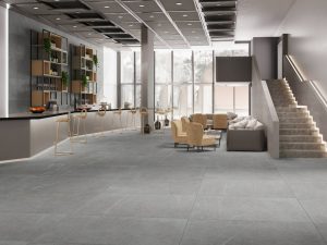 Future-Proof Your Floors with Timeless Larger Tiles 1 Grey tile in a Modern lobby with sleek design elements.