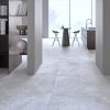 Modern interior with white-travertine look porcelain tile floor in the large format 48x48 size