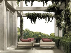 an elegant patio with 48x48 limestone beige in & out tile