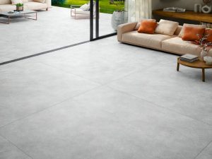 63x63 Aura Pearl limestone stone look tile extending into the patio from the Living room