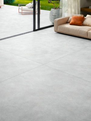 63x63 Aura Pearl limestone stone look tile extending into the patio from the Living room