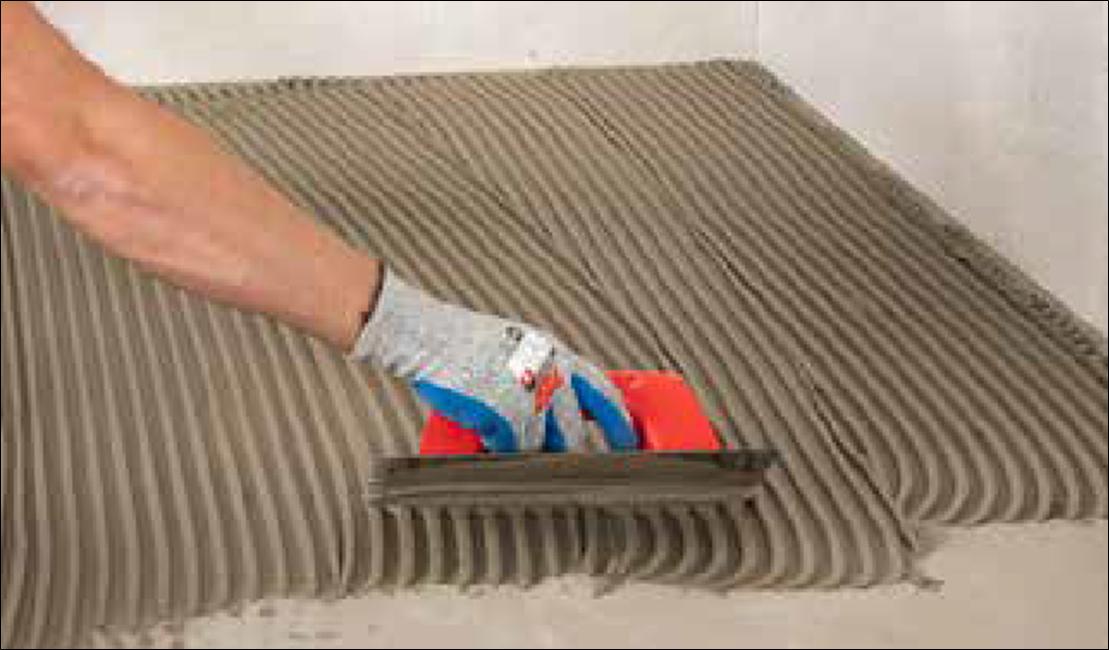 Ceramic and Porcelain Tile Installation Guide 39 appalying the adhesive to the floor with a trowel