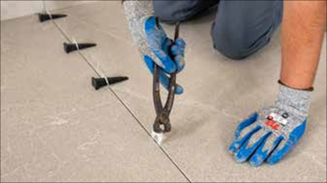 Ceramic and Porcelain Tile Installation Guide 5 removing leveling clips before grouting the joints