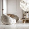 Luxurious modern living room featuring Intarsi Farida 24x48 porcelain flooring with gold geometric inlays and contemporary white furniture.