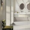 Contemporary bathroom floor featuring Intarsi Civita 24x48 large-format porcelain tiles with a traditional basketweave mosaic aesthetic.