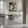 Luxurious commercial interior featuring Intarsi Vinci 24x48 mosaic-look porcelain flooring with a continuous geometric inlay design in a high-end retail setting.