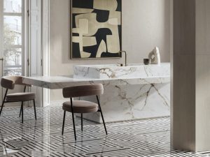 Luxurious commercial interior featuring Intarsi Vinci 24x48 mosaic-look porcelain flooring with a continuous geometric inlay design in a high-end retail setting.