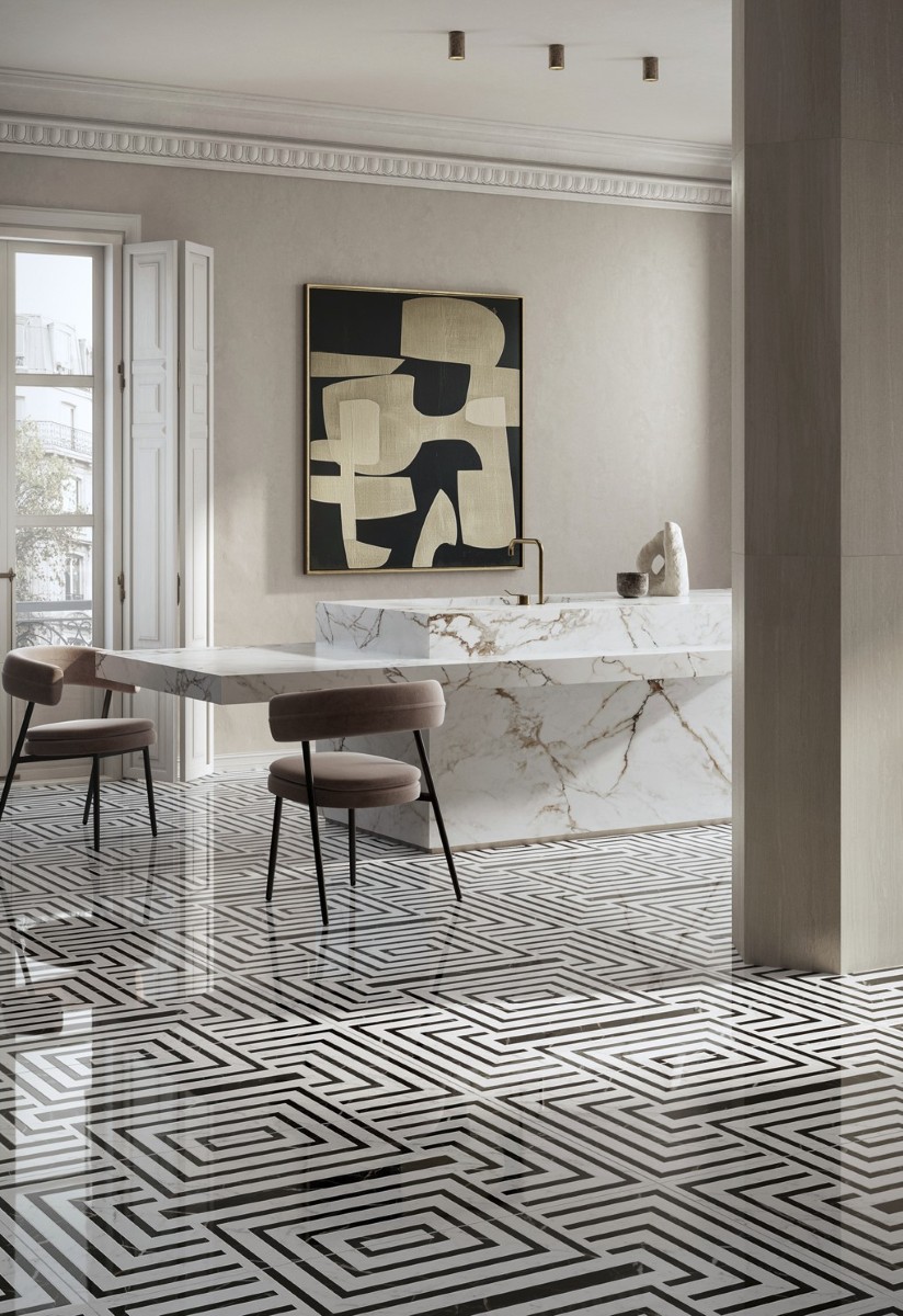 Luxurious commercial interior featuring Intarsi Vinci 24x48 mosaic-look porcelain flooring with a continuous geometric inlay design in a high-end retail setting.