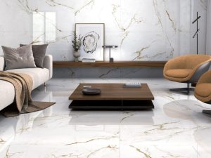 large format 48x48 Calacatta Gold look porcelain tile in a living room