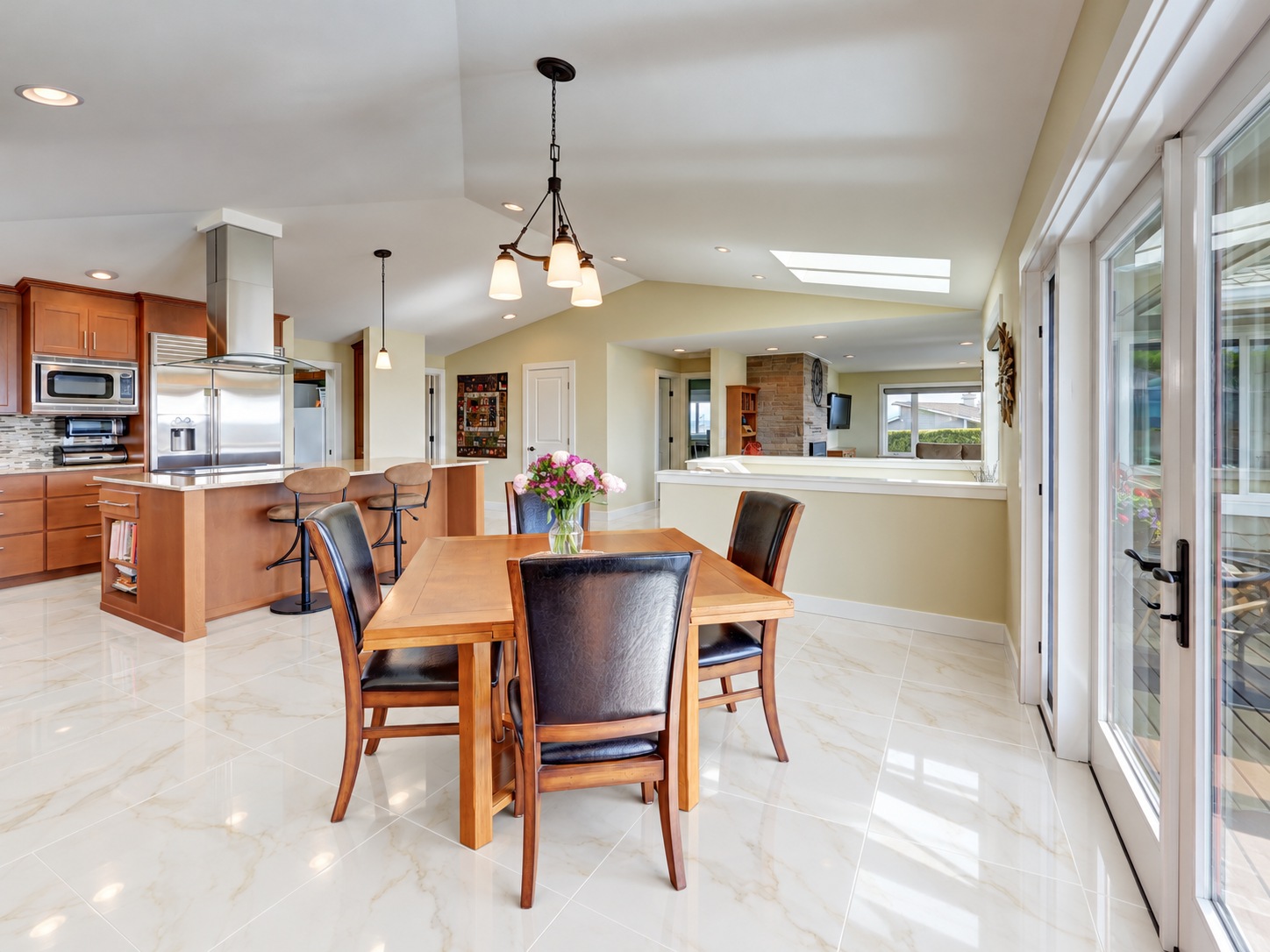 Calacatta Puro polished porcelain tile installed in a kitchen and dining area