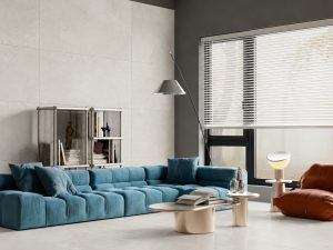a Modern Living room with 32x63 Cosmo White concrete look tile looking seamless.