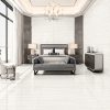 Vein cut onyx tile in a polished bedroom floor and wall installation