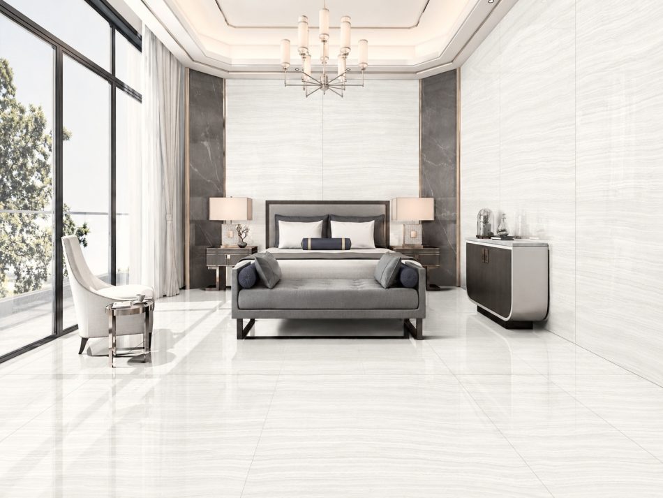 Vein cut onyx tile in a polished bedroom floor and wall installation